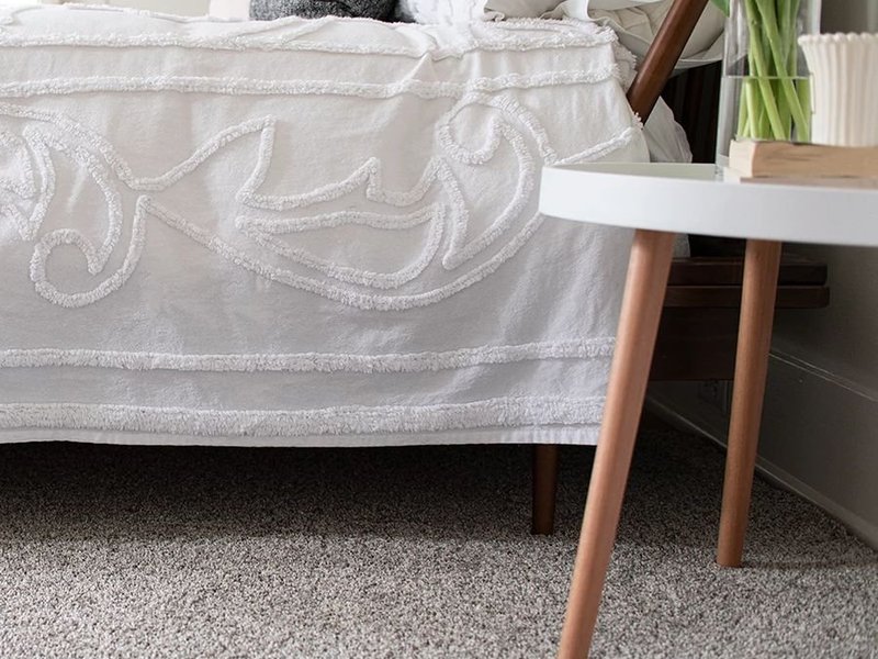 Bed and coffee table on carpet floor - CARPET LOVER PLUS in MA